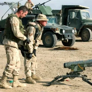 Staff Sgts. aim a rocket launcher during training