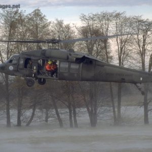 UH-60L Black Hawk hovers over California floodwaters