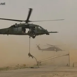 Pararescueman drops from an HH-60G Pave Hawk