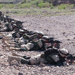 Infantrymen shoot their rifles