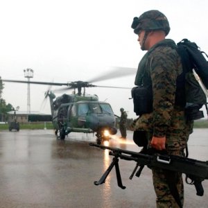 Marines prepare to board an Air Force HH-60G