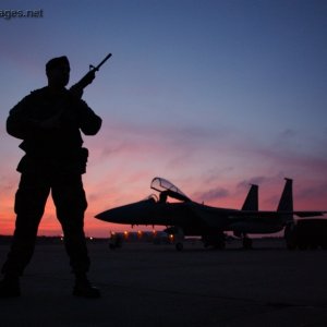 Staff Sgt. guards an F-15 Eagle