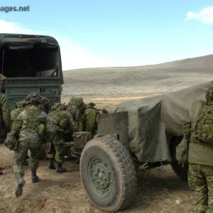 Gun crew prepares to move their 105mm howitzer