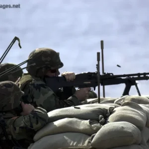 Sailor fires a M-60 machine gun