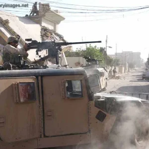 Soldier fires a 50-caliber machine gun