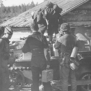 SS-men loading ammunition