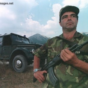 An Albanian military policeman stands guard