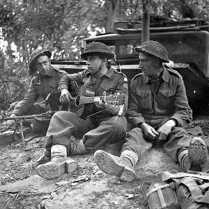 British Tommy playing Guitar