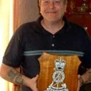 ME HOLDING A PLAQUE OF THE ROYAL PIONEER CORPS. 2005.