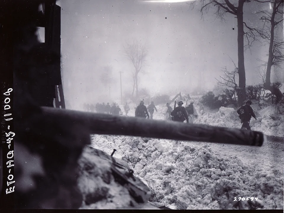 000-2nd Division, 644th Tank Destroyer Btln, 2nd Pltn, Co. A soldiers pass a tank destroyer as...jpg