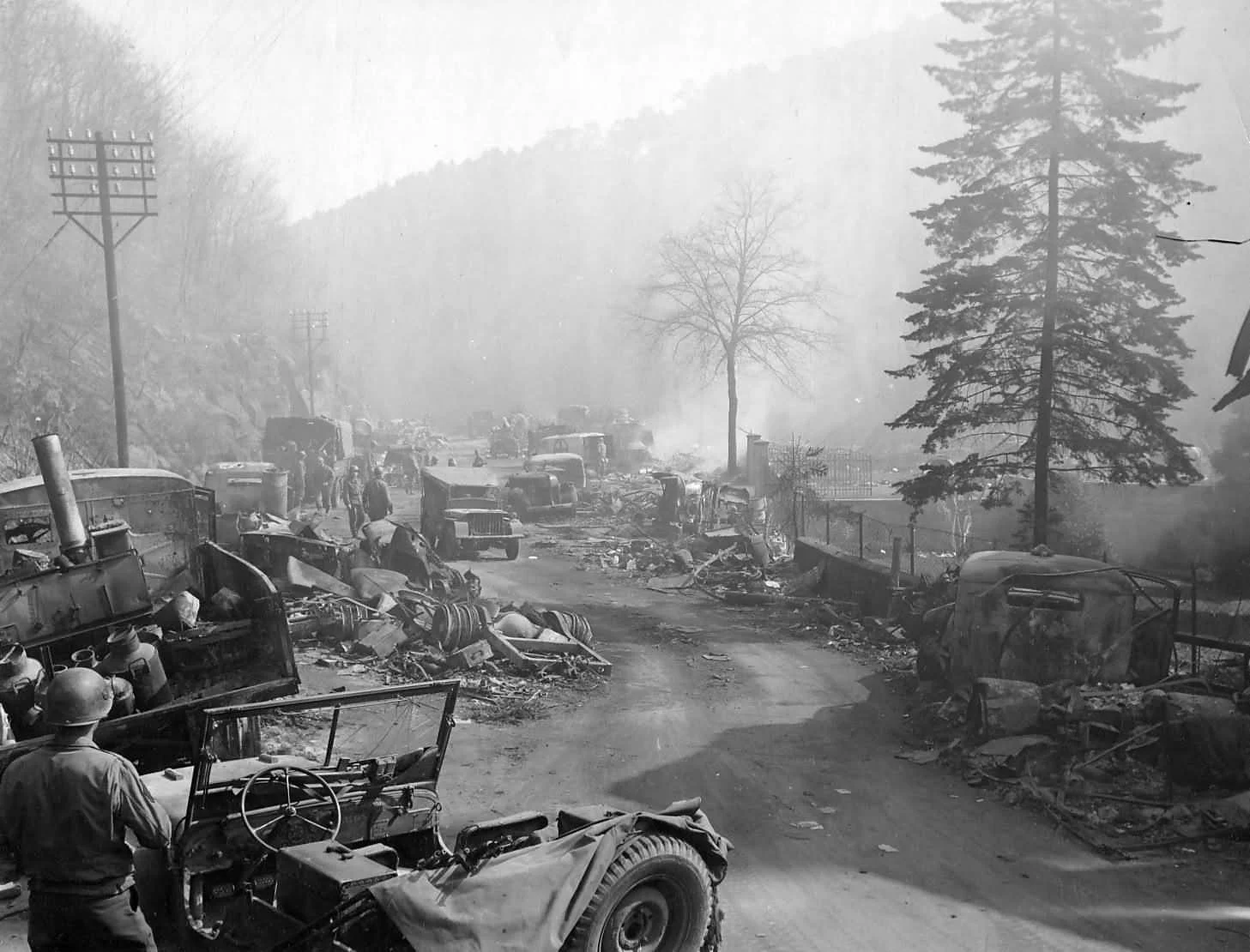 0000-German_Trucks_Wrecks_On_Road_Durkheim_Germany_1945.jpg