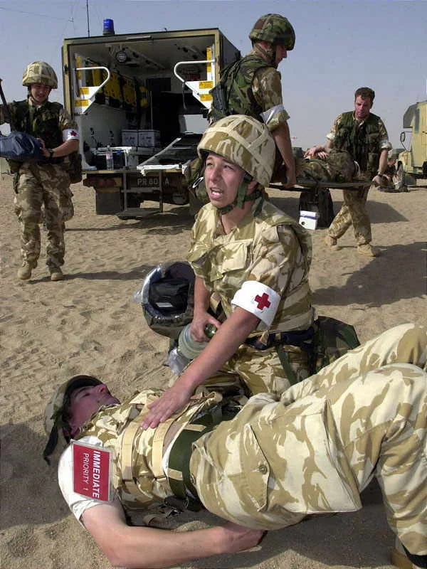 A Royal Marine receives first aid