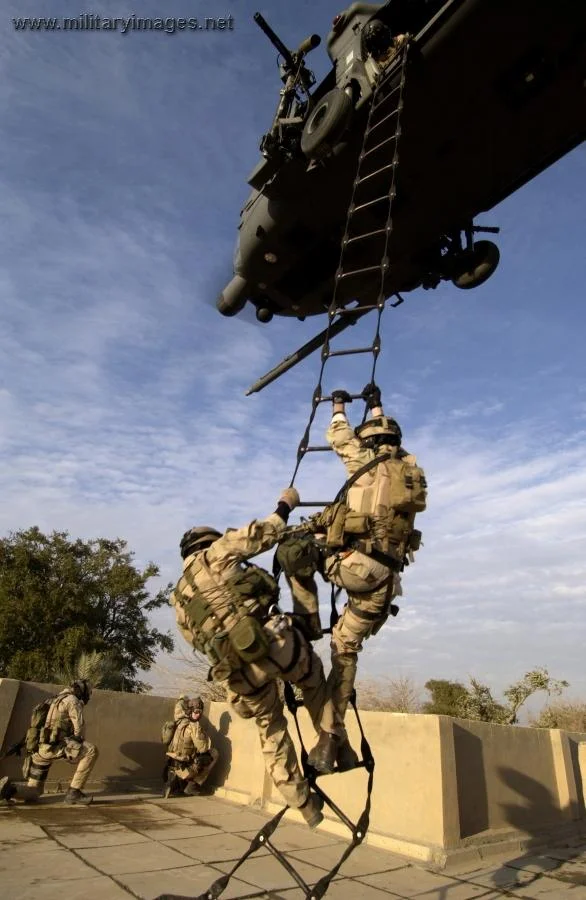 Air Force pararescuemen are extracted by a HH-60G