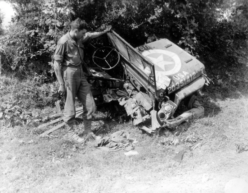 American Willys Jeep (Willys), or what's left of it after hitting an anti-tank mine on the ro...jpeg