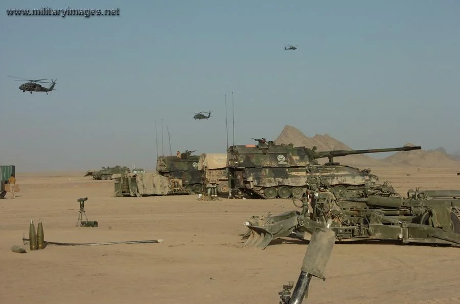 Canadian M777 in A-stan with Dutch AS90
