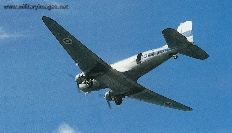 Douglas DC-3 climbing out with door open in June 1981