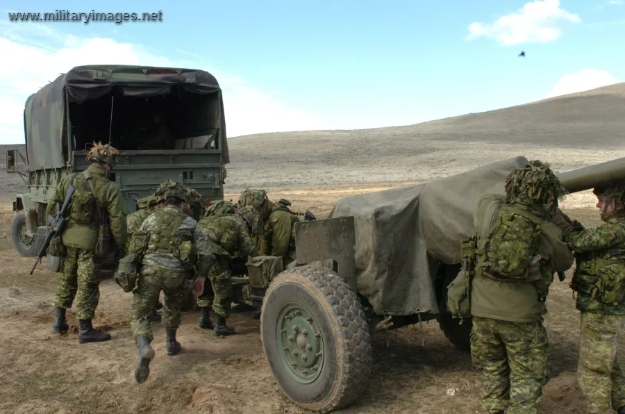 Gun crew prepares to move their 105mm howitzer