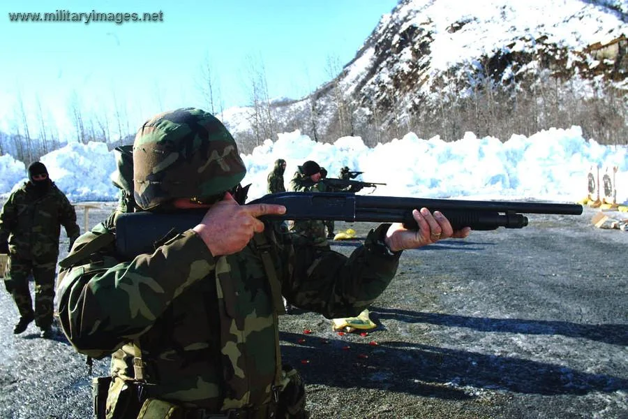 Master at Arms 1st Class with a shotgun