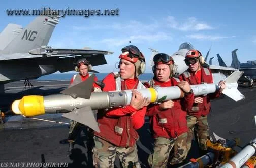 Ordanance crews load an AIM-9