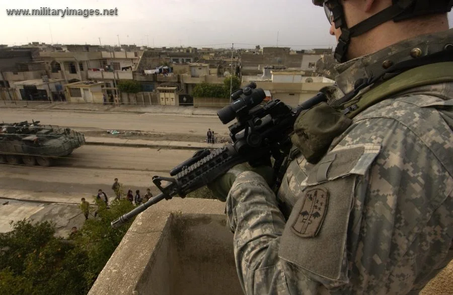 Overwatch security during a patrol in Mosul, Iraq