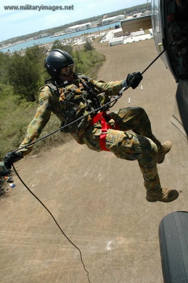 Petty Officer rappels from a MH-60S Seahawk