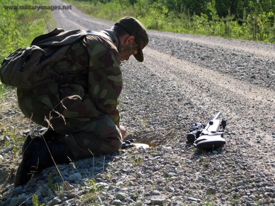 Ranger sniper placing a landmine at Ex Krpp 2005