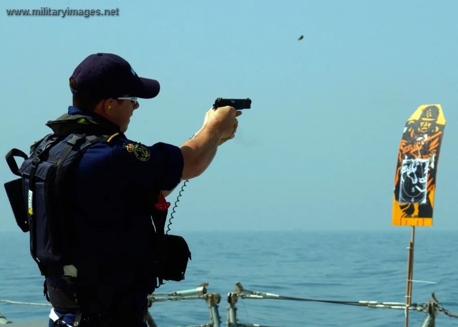 Sailor participates in a small arms live fire exercise