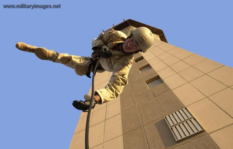 Senior Master Sgt. performs a rappelling exercise