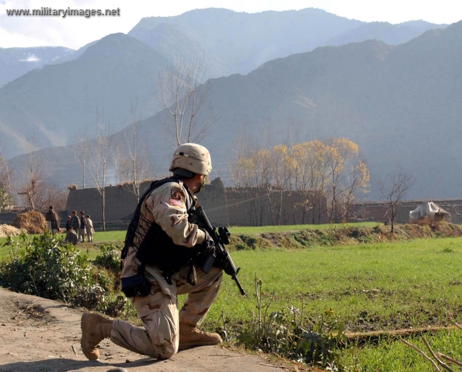 Soldier patrols Manoi, Afghanistan
