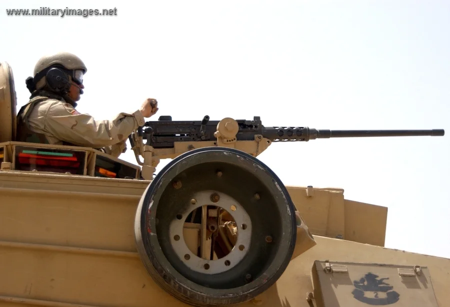 Soldier prepares to fire a .50-caliber machine gun
