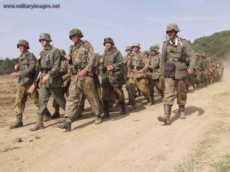 SS Pz Grens move in formation Reenactors