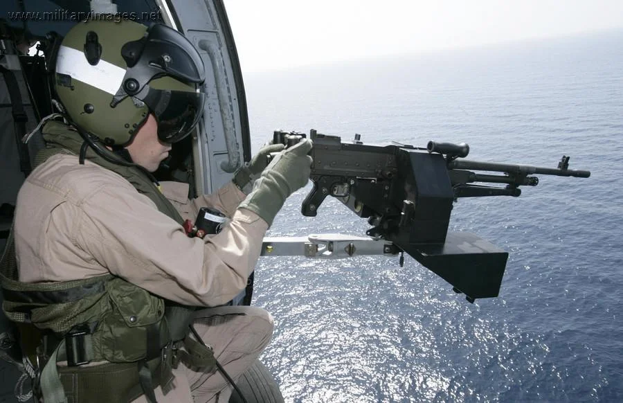 Sub Lieutenant Hampton mans the Mag 58 door gun