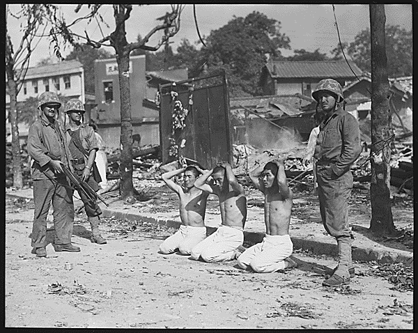 US. Marines with Three North Korean POW's, 1950