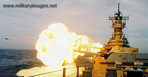 USS Missouri firing Big Guns with visible projectile